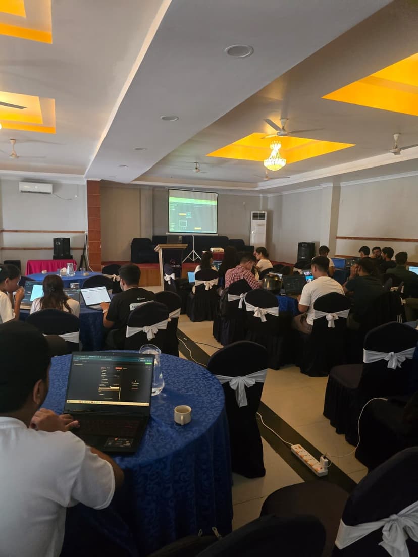 Students following along on laptops during the n8n workshop
