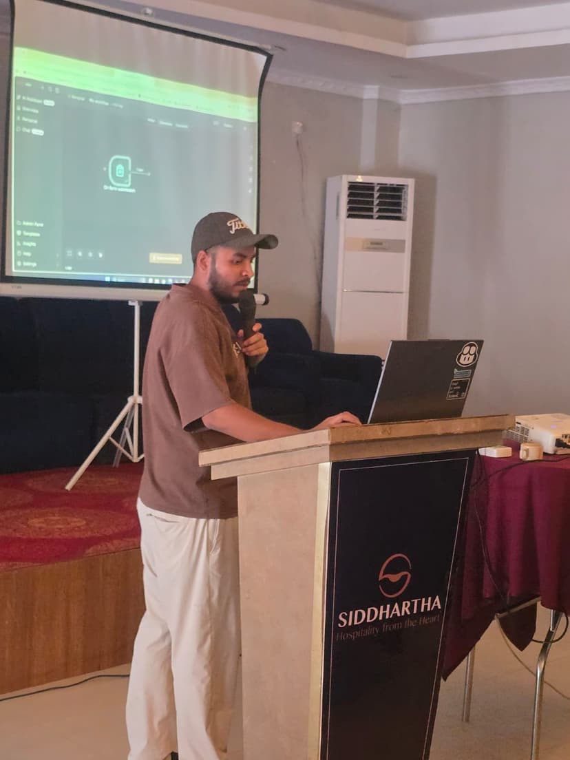 Tushar Rayamajhi presenting an n8n workflow at the podium
